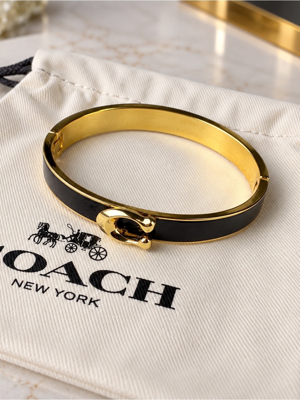 COACH Black and Gold Enamel Hinged Bangle Bracelet